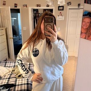 White Pullover Hoodie with Navy Chest Patch and Sleeve Logo